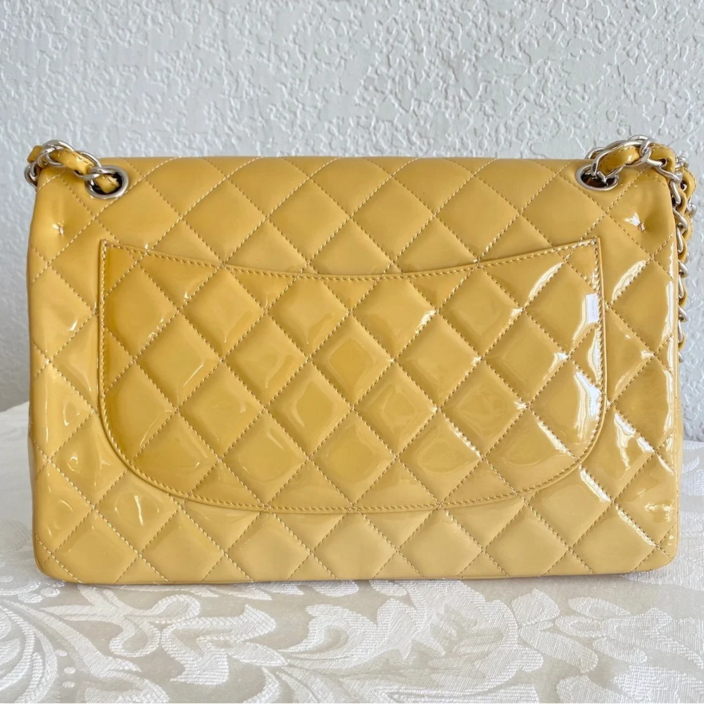 CHANEL Timeless Jumbo double flap shoulder bag in beige yellow patent le…